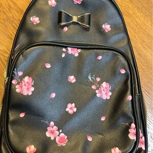 Black/pink flowered backpack